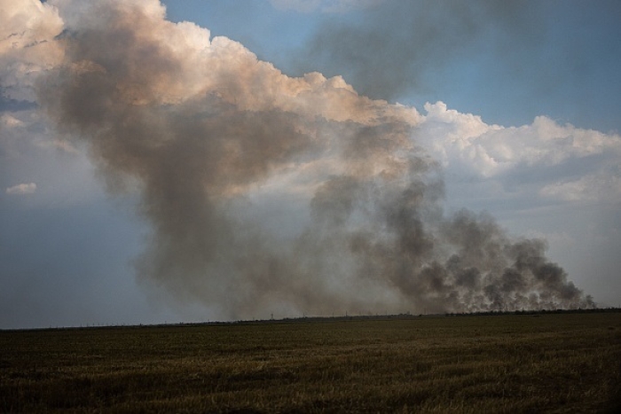 Smoke rises at the front line in the fighting between Ukrainian and Russian forces as a major counteroffensive gets underway in a bit to retake Kherson city and the surrounding region. (Photo by Dimitar Dilkoff / AFP via Getty Images)
