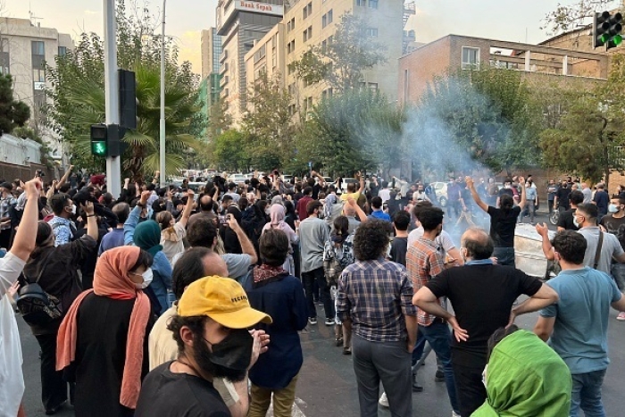 Iranians protest in Tehran on Monday over the death in custody of Mahsa Amini, days after she was arrested by the regime’s “morality” police who enforce a strict dress code. (Photo by AFP via Getty Images)
