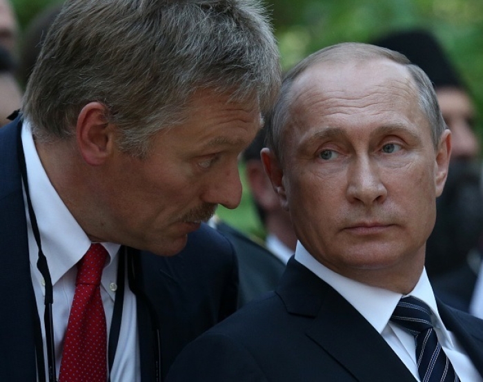 Russian President Vladimir Putin and Kremlin press secretary Dmitry Peskov. (Photo by Mikhail Svetlov/Getty Images)