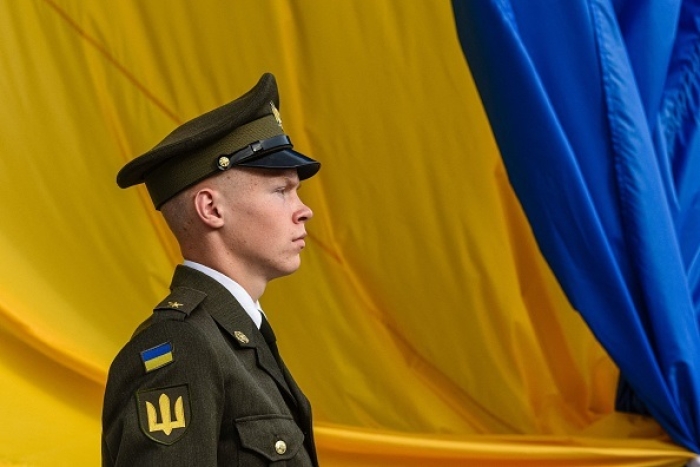 A Ukrainian honor guard member ats a ceremony to mark National Flag Day, in Lviv last month. (Photo by Yuriy Dyachyshyn / AFP via Getty Images)