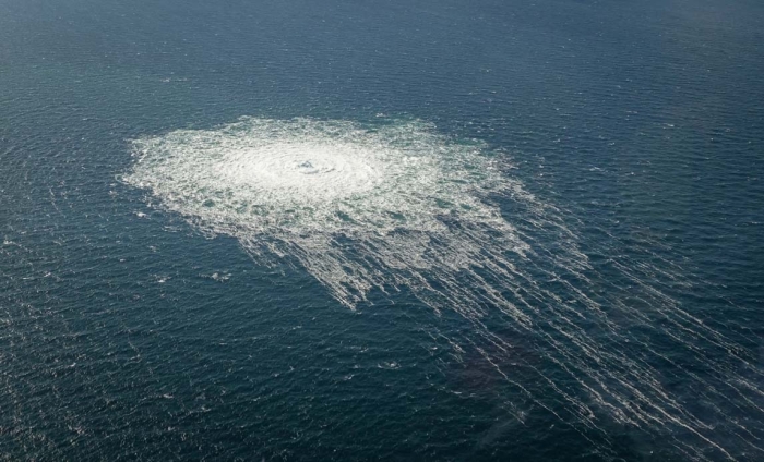 The effects of one of the three underwater pipeline gas leaks are visible on the surface of the Baltic Sea in a photograph taken by a Danish F16. (Photo: Danish Defense)