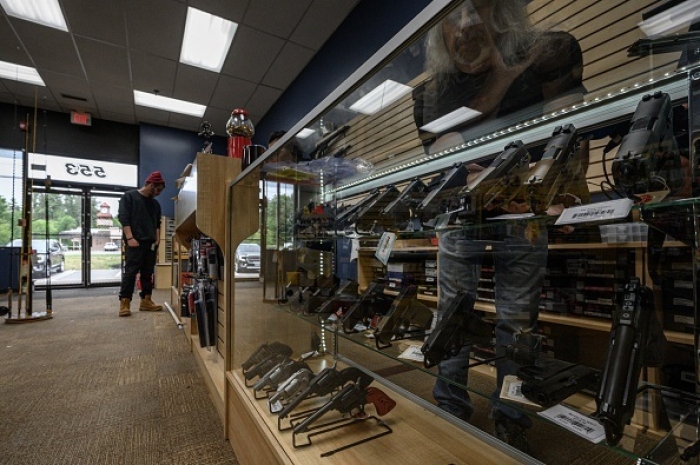 A customer browses at a Goffstown, New Hampshire gun store on June 2, 2022. (Photo by ED JONES/AFP via Getty Images)