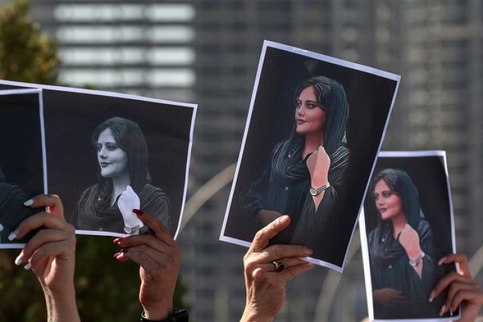 Demonstrations in solidarity with Iranian women were held in a number of countries over the weekend. In Iraq’s Kurdish region, women hold up photos of Mahsa Amini, the 22-year-old Iranian woman whose death in police custody sparked major anti-regime protests over the last ten days. (Photo by Safin Hamed / AFP via Getty Images)