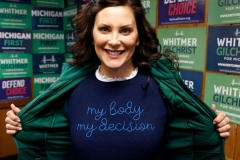 Michigan State Governor Gretchen Whitmer shows a "My Body My Decision" shirt at the 14th District Democratic Headquarters, during the US midterm election in Detroit, Michigan, on November 8, 2022. (Photo by JEFF KOWALSKY/AFP via Getty Images)